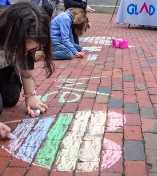 Young attendees at the Rally for Massachusetts Families at the State House June 1 show some love.