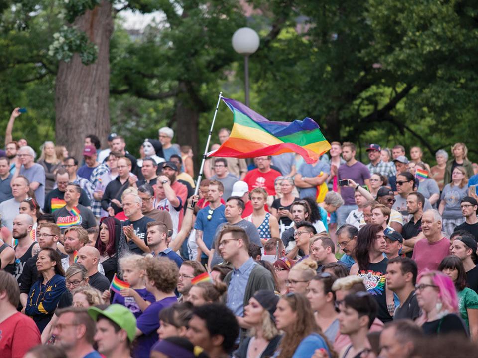 Around 3000 people gathered in Loring Park to unite in the wake of the Orlando, Florida shooting in a gay nightclub that killed at least 50 people. Speakers called for facing violence against the LGBTQA community with solidarity and love. Photo by Fibonacci Blue, via Flickr.