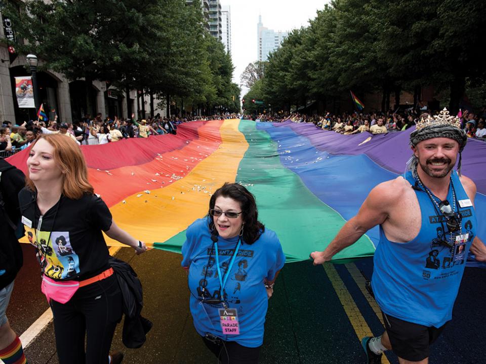 A massive rainbow flag is carried through the city's Midtown district during the annual Gay Pride Parade in Atlanta, Ga., Oct. 13, 2019. AP Photo by Robin Rayne.