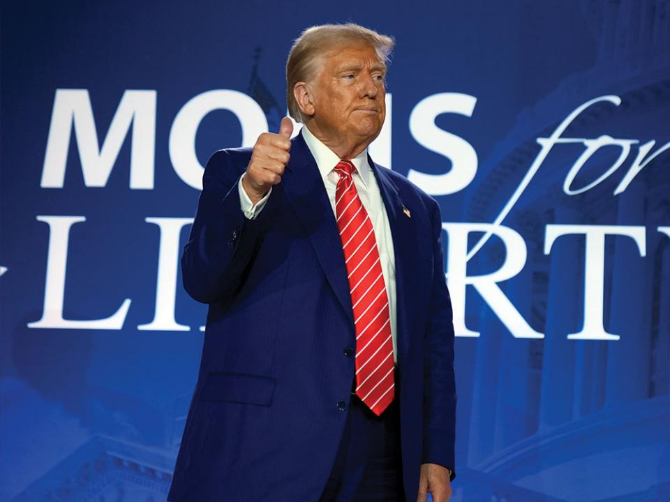 Republican presidential nominee former President Donald Trump gestures after speaking with Moms for Liberty co-founder Tiffany Justice during an event at the group's annual convention in Washington, Friday, Aug. 30, 2024. AP Photo by Mark Schiefelbein.