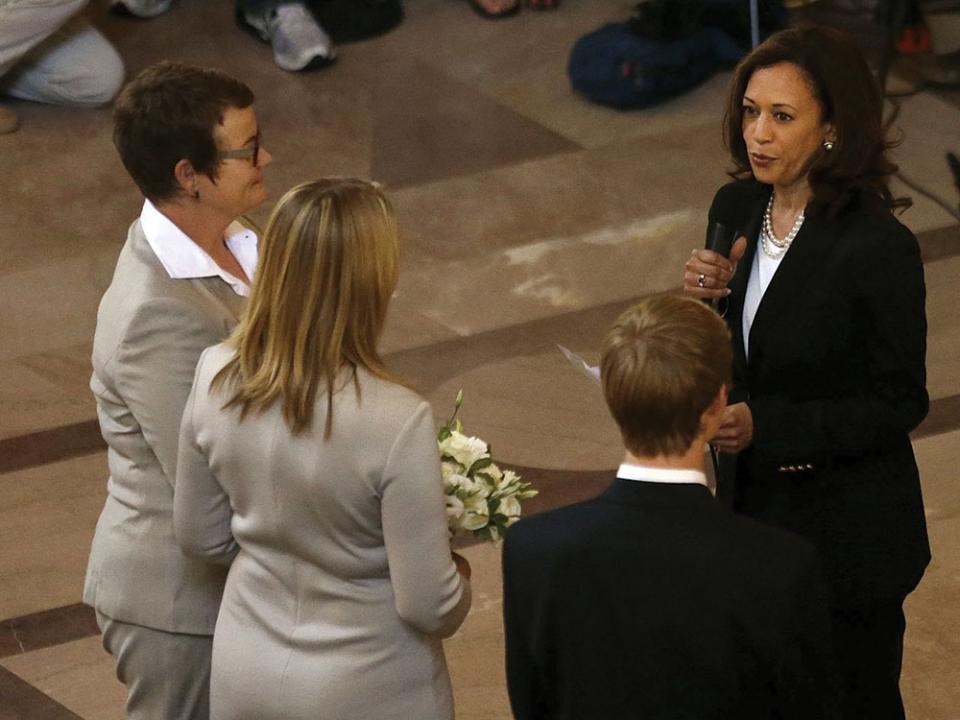 Then Attorney General Kamala Harris, right, officiates the wedding of Kris Perry, from left, and Sandy Stier, in San Francisco in 2013. Photo by Jeff Chiu, Associated Press.